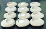 12 handmade natural grey concrete tea light holders shaped like smooth cobblestones 